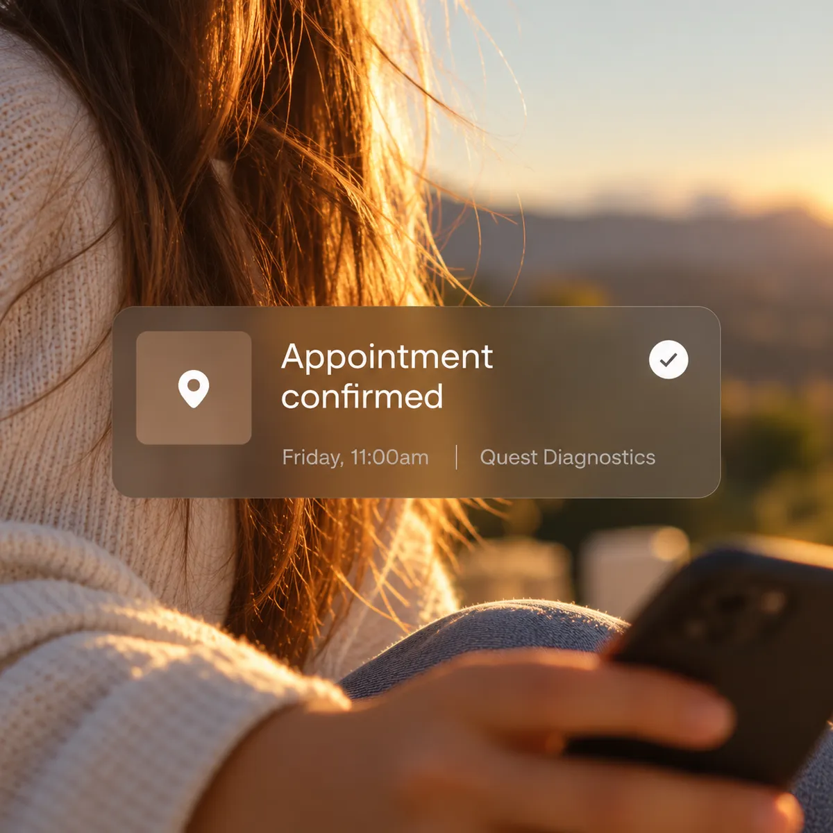A woman holding her phone at sunset, with an appointment confirmation shown